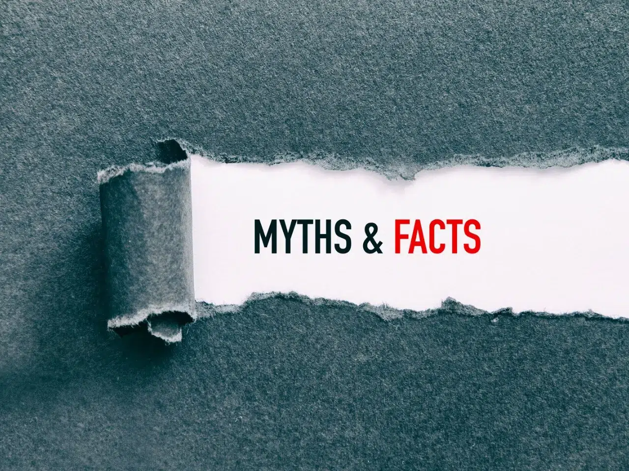 A piece of gray paper is torn to reveal the words “MYTHS & FACTS” underneath, with “MYTHS &” in black text and “FACTS” in red text on a white background.